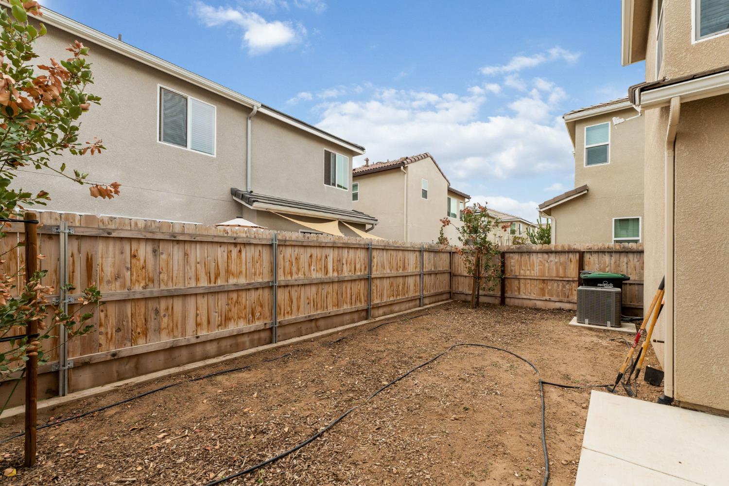1106 Significant Way West Madera, CA 93636 - Photo 32 of 41 a view of a house with wooden fence