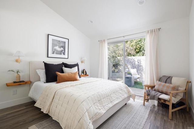 a bedroom with bed and a window