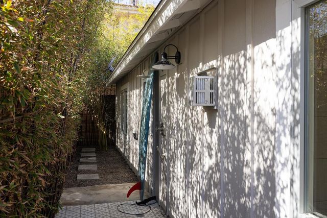 a patio with sofas fire pit table and chairs