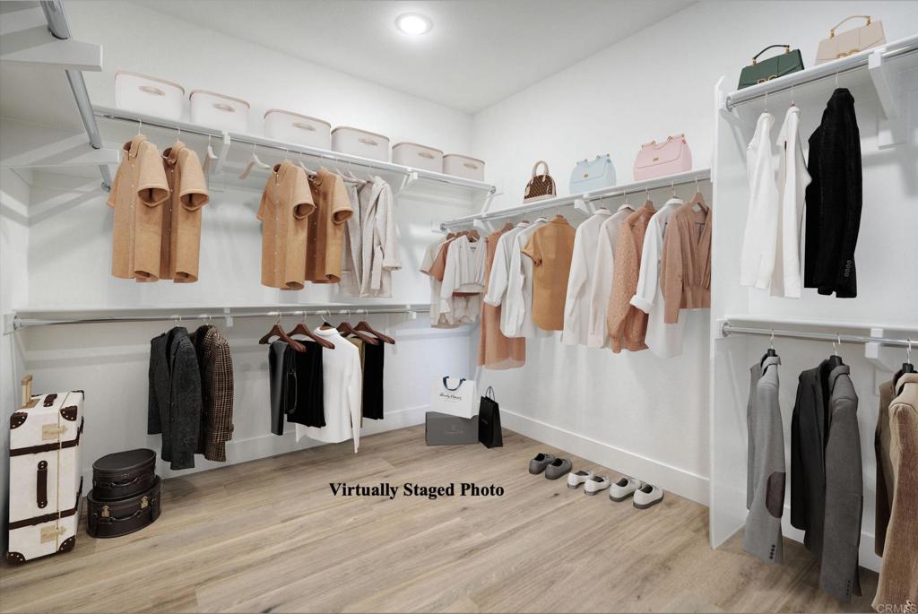 12073 Via Trevi, Unit LOT 2 Lakeside, CA 92040 - Photo 12 of 33 a view of walk in closet with clothes and shoes