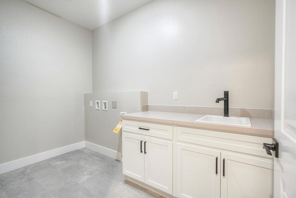 12073 Via Trevi, Unit LOT 2 Lakeside, CA 92040 - Photo 13 of 33 a bathroom with a sink