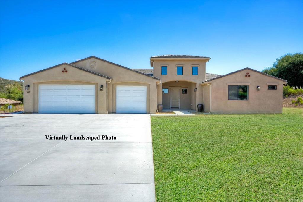 12073 Via Trevi, Unit LOT 2 Lakeside, CA 92040 - Photo 2 of 33 a view of a white house with a big yard