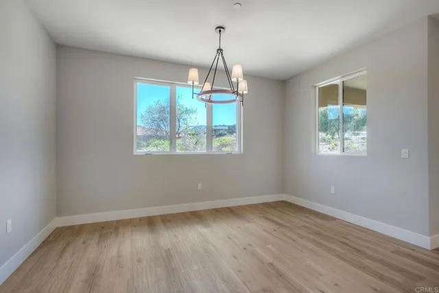 a white bath tub sitting in a bathroom next to a window