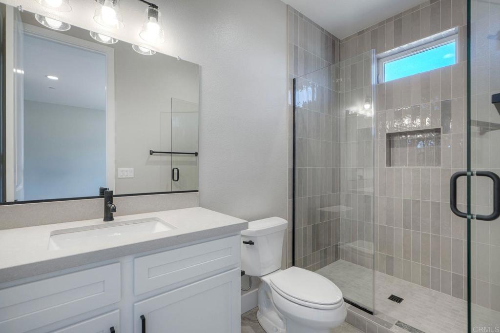 12073 Via Trevi, Unit LOT 2 Lakeside, CA 92040 - Photo 29 of 33 a bathroom with a sink a toilet and shower