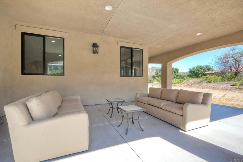 12073 Via Trevi, Unit LOT 2 Lakeside, CA 92040 - Photo 32 of 33 a living room with furniture and a large window