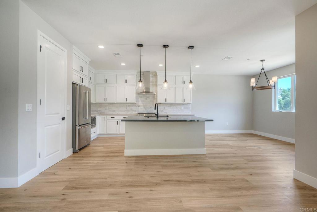 12073 Via Trevi, Unit LOT 2 Lakeside, CA 92040 - Photo 5 of 33 a view of kitchen with wooden floor
