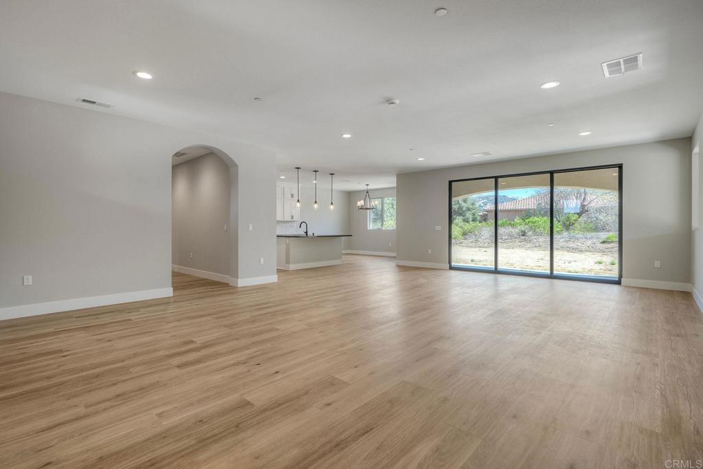 12073 Via Trevi, Unit LOT 2 Lakeside, CA 92040 - Photo 7 of 33 a view of empty room with wooden floor and fan