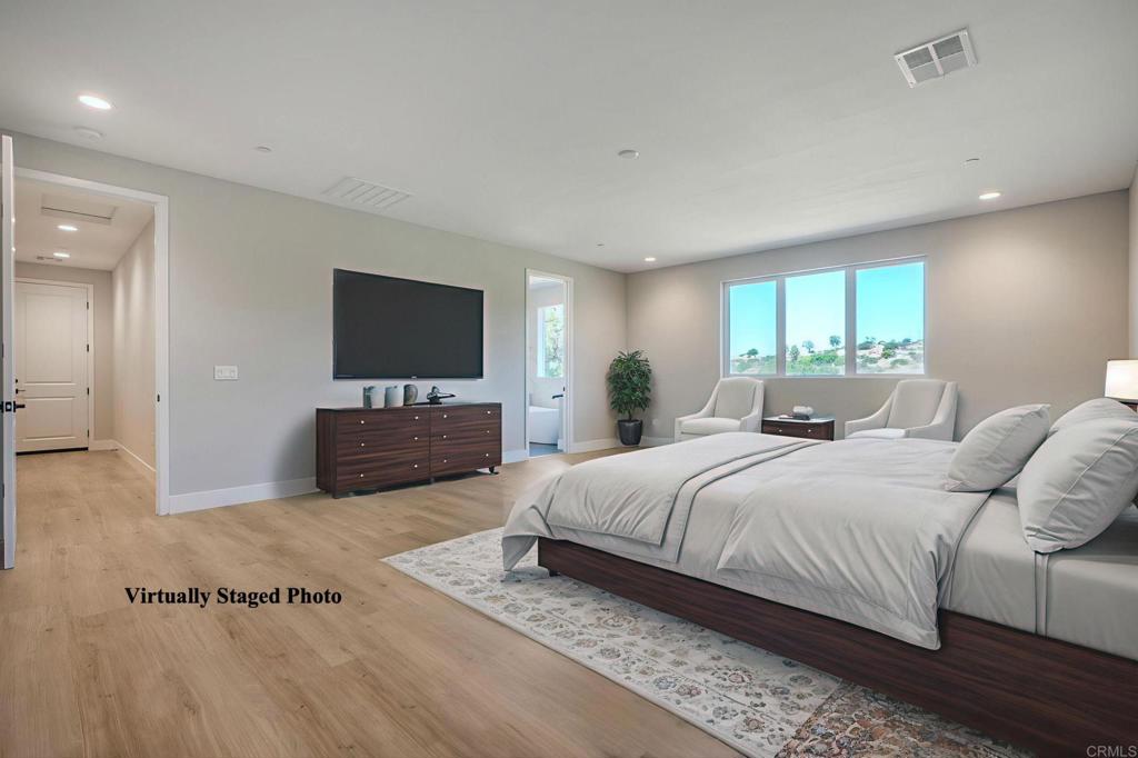 12073 Via Trevi, Unit LOT 2 Lakeside, CA 92040 - Photo 10 of 33 a bedroom with a large bed and a flat screen tv