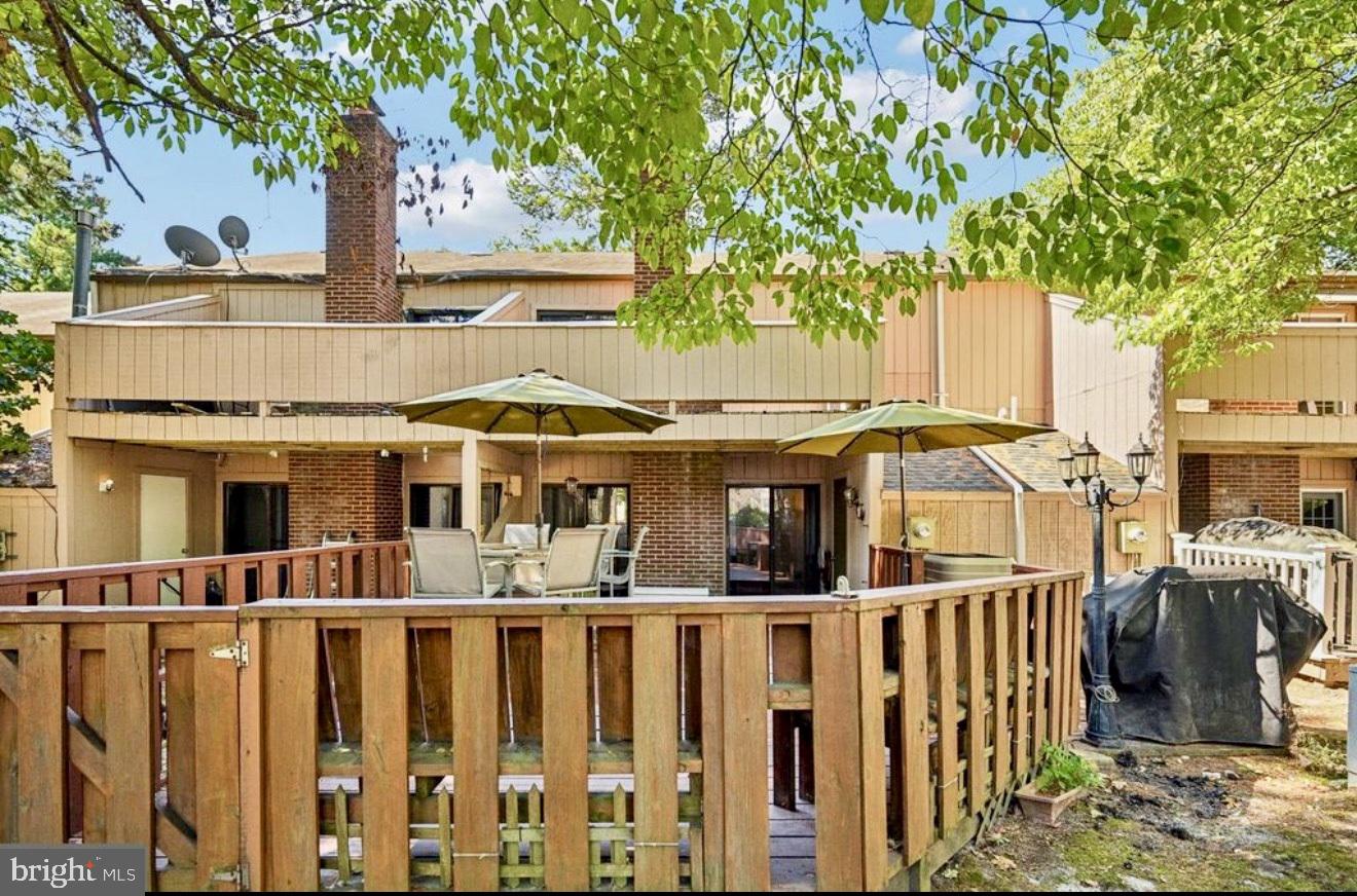 1502 Bromley Estate Pine Hill, NJ 08021 - Photo 29 of 33 Charming deck nestled in lush greenery.