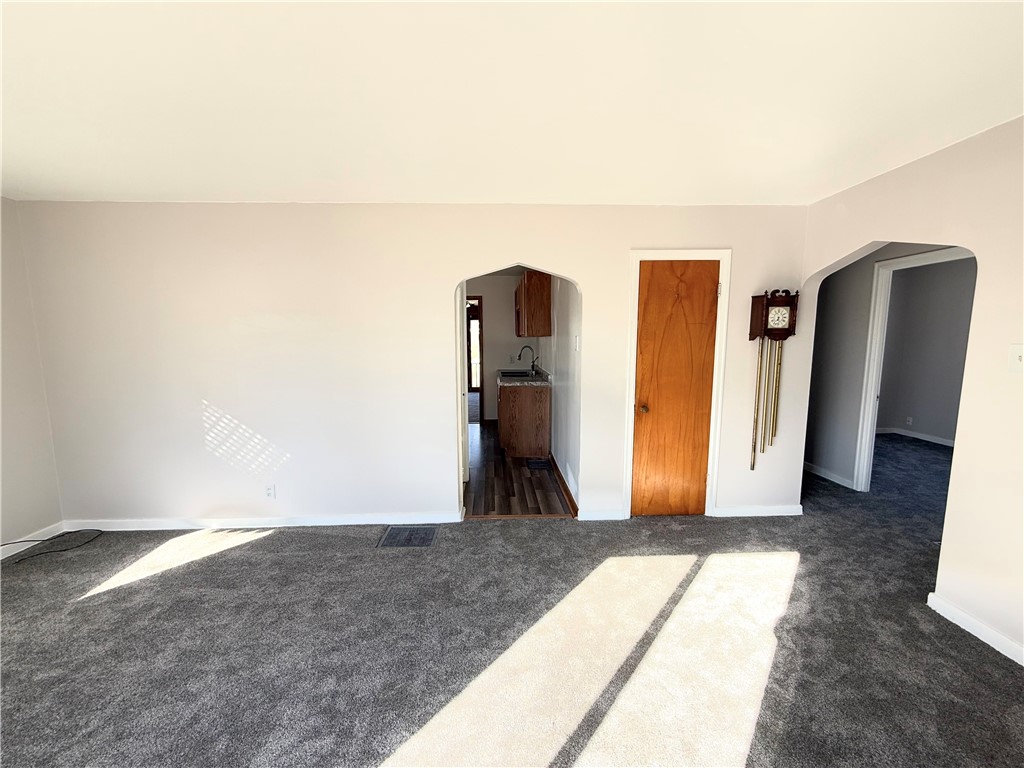 955 North McClellan Street Decatur, IL 62522 - Photo 3 of 17 a view of a livingroom with wooden floor and a hallway