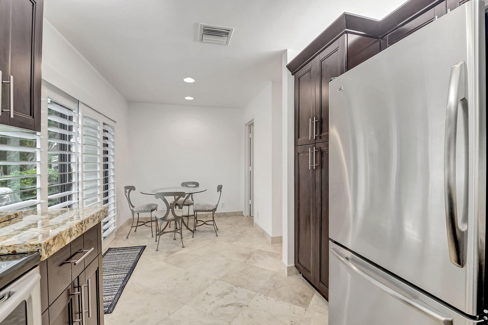 804 Foxpointe Circle Delray Beach, FL 33445 - Photo 20 of 43 a view of a dining room with furniture window and outside view