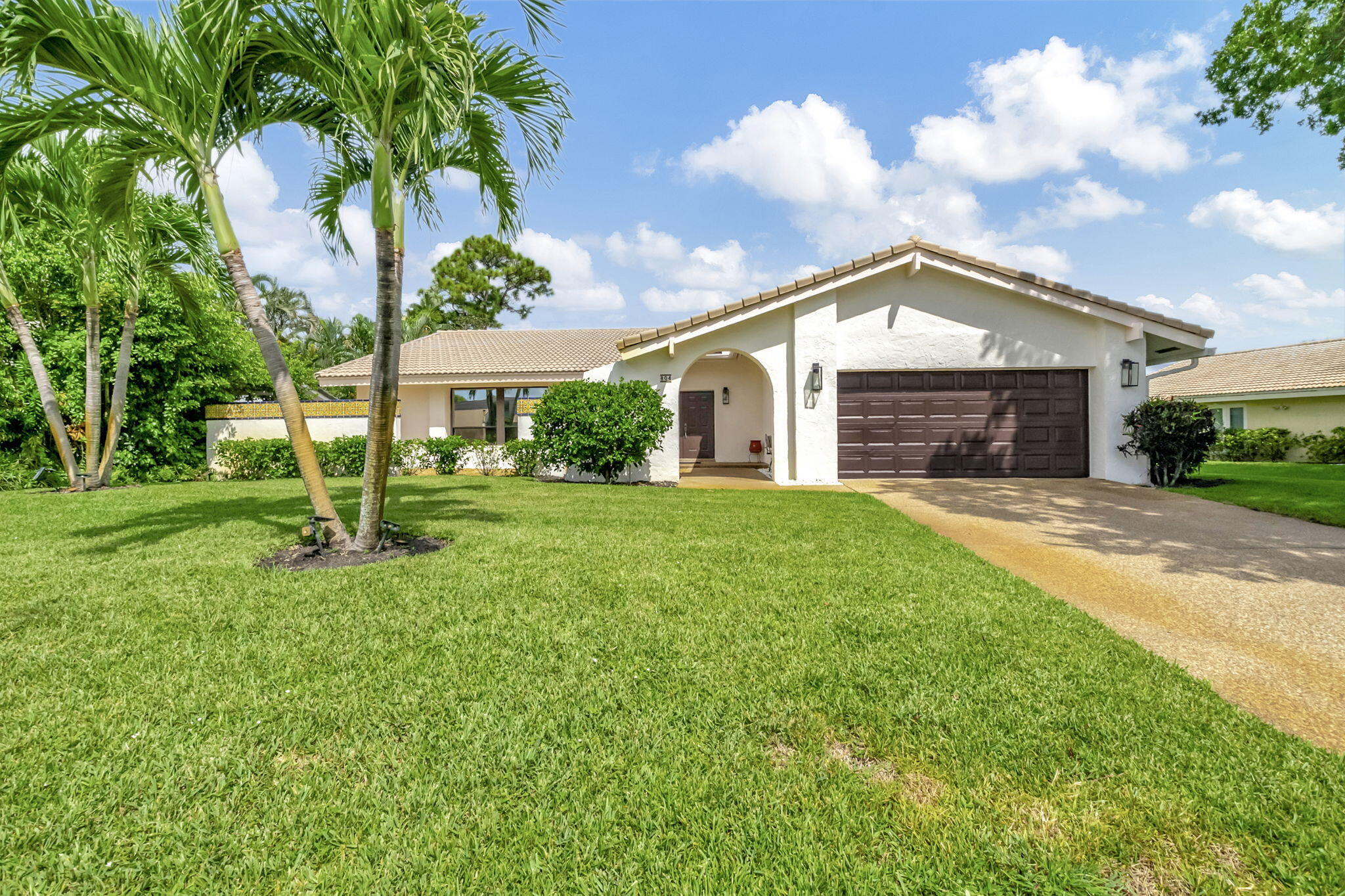 804 Foxpointe Circle Delray Beach, FL 33445 - Photo 2 of 43 a view of house with a big yard and potted plants