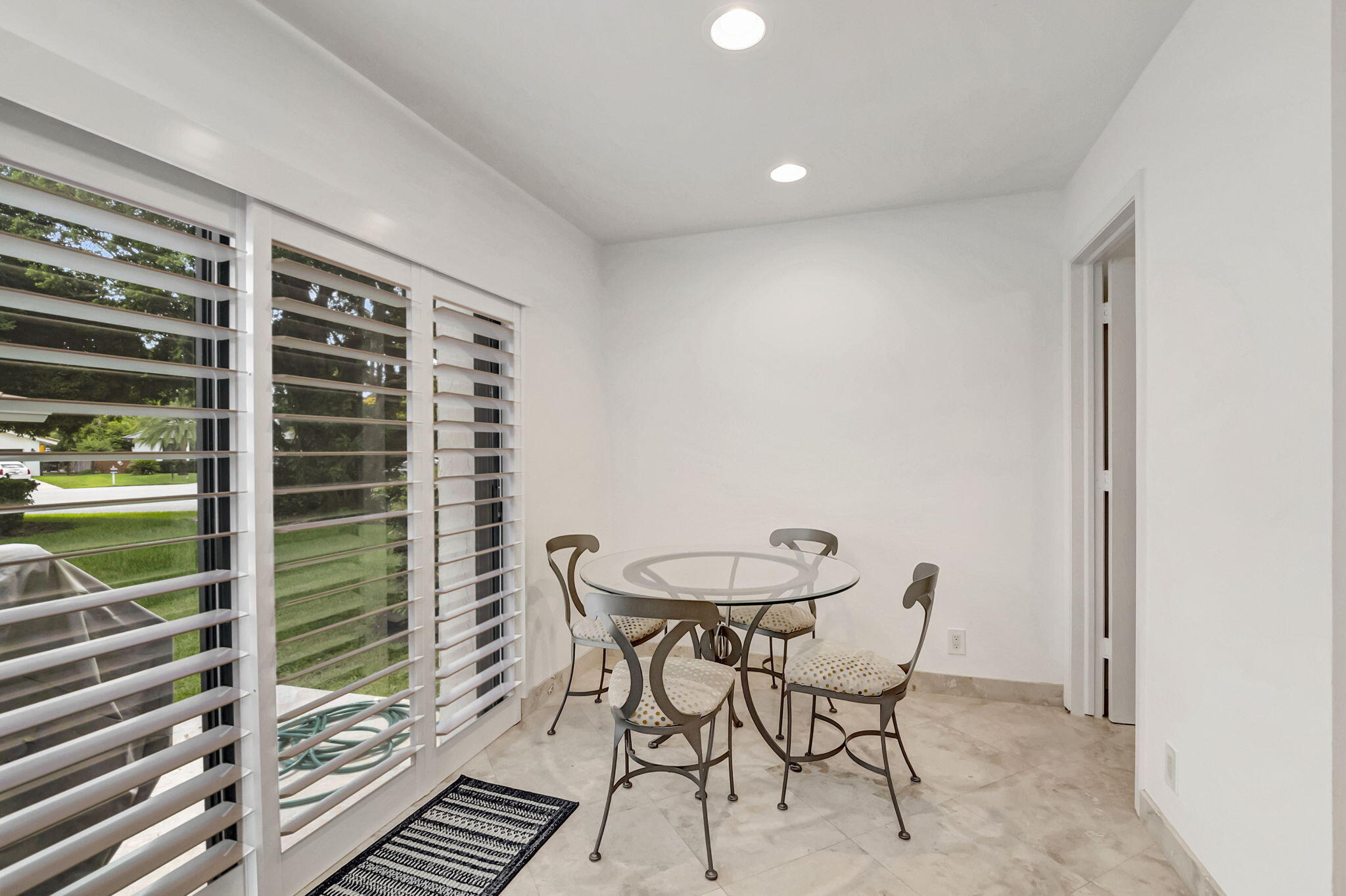 804 Foxpointe Circle Delray Beach, FL 33445 - Photo 21 of 43 a view of a room with a table and chairs