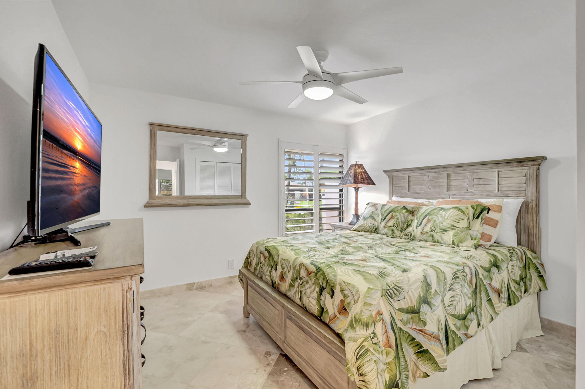 804 Foxpointe Circle Delray Beach, FL 33445 - Photo 24 of 43 a bedroom with a large bed and a flat screen tv