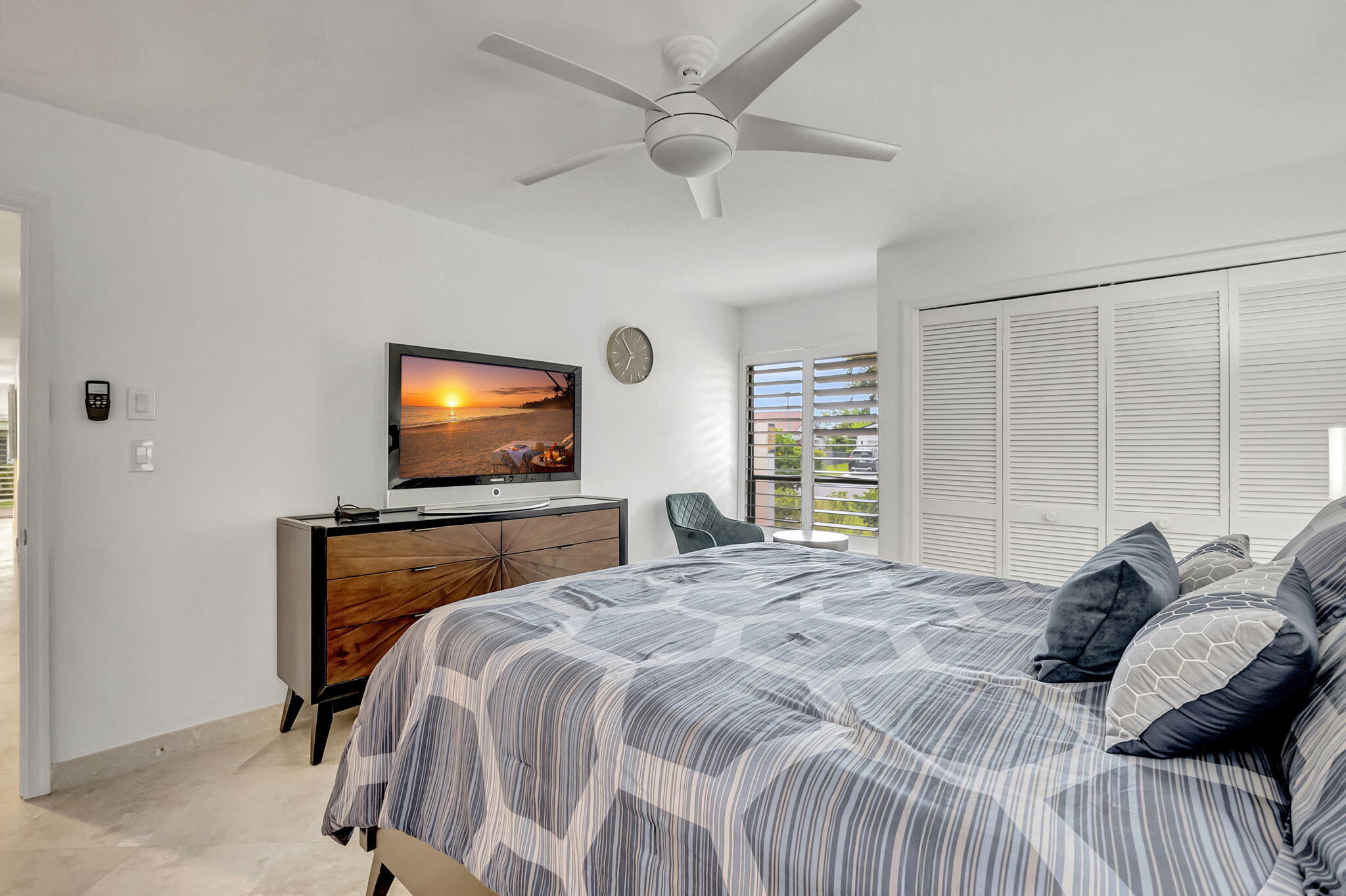 804 Foxpointe Circle Delray Beach, FL 33445 - Photo 28 of 43 a bedroom with a bed and a flat screen tv