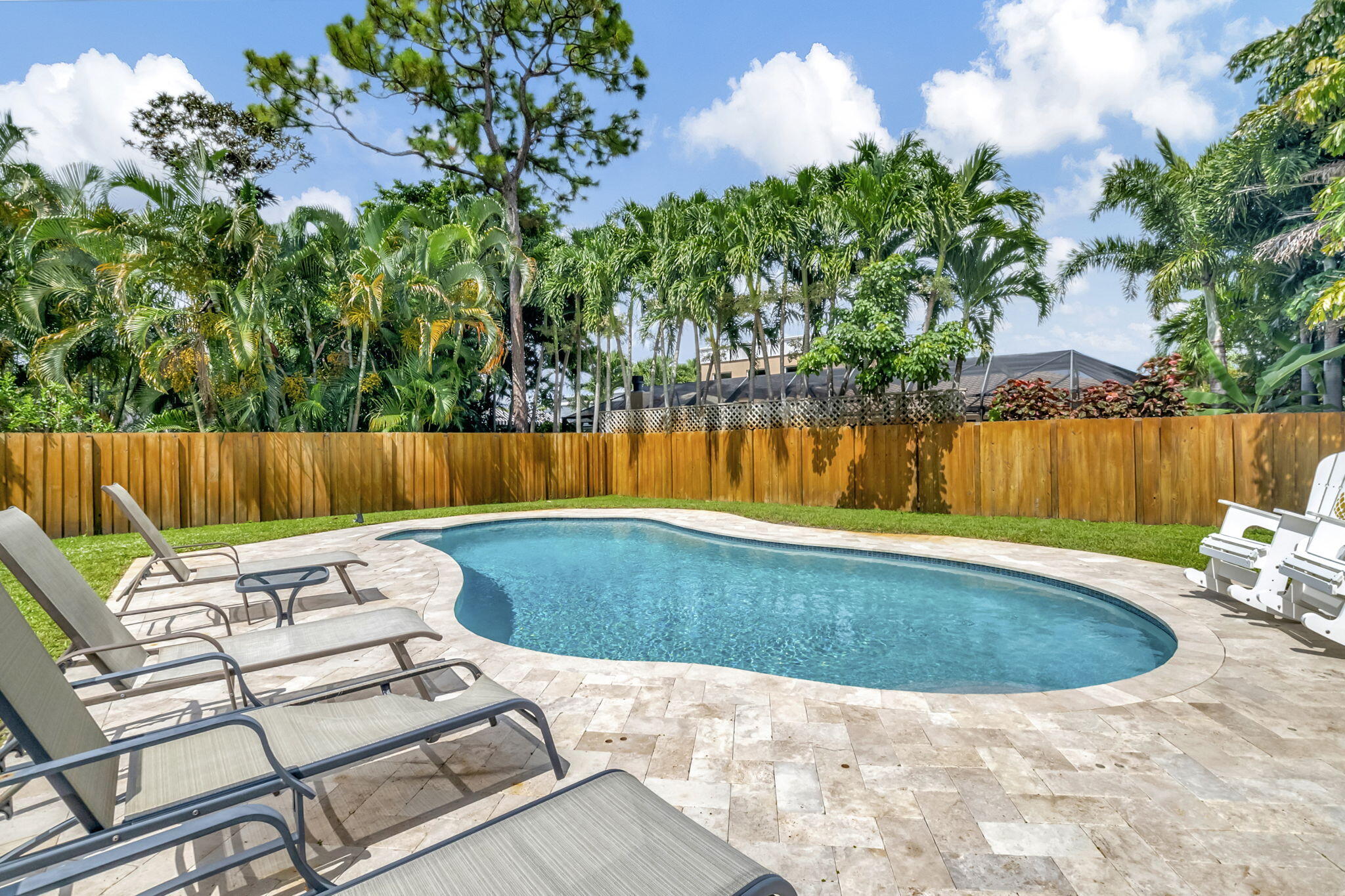 804 Foxpointe Circle Delray Beach, FL 33445 - Photo 36 of 43 a view of a swimming pool with a patio