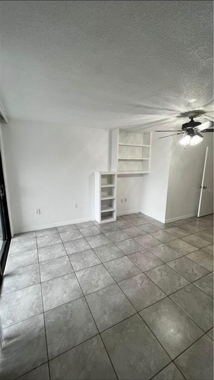 707 Southwest 75th Street, Unit 109 Gainesville, FL 32607 - Photo 7 of 13 a view of a room with an empty space and window