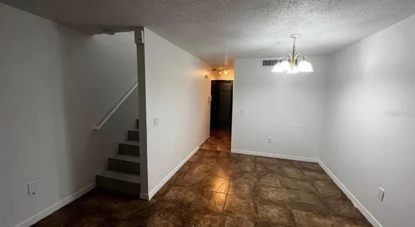 wooden floor in an empty room with a gallery