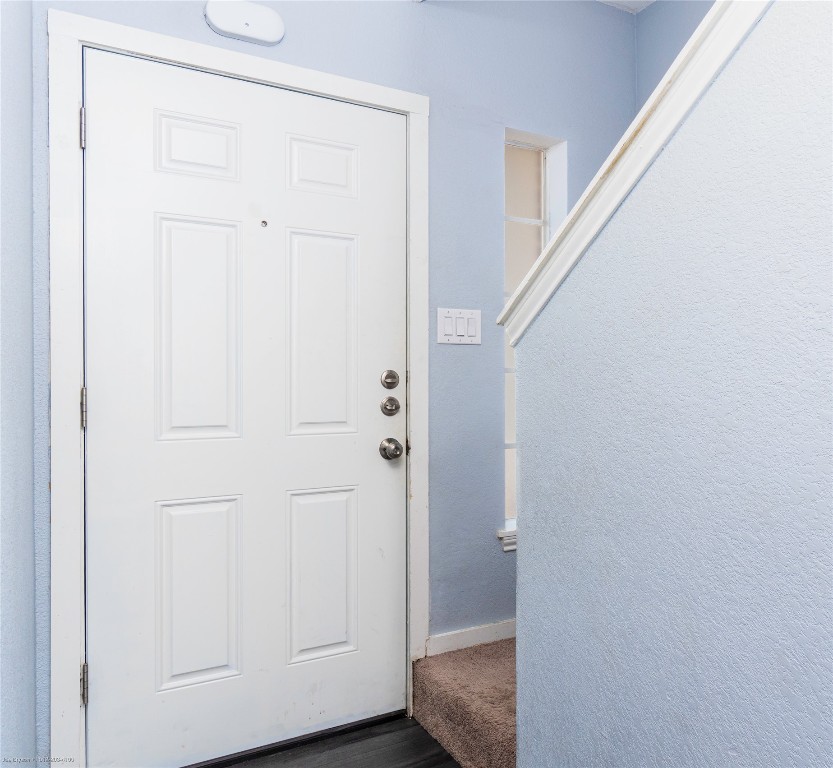1845 River Crossing Circle, Unit C Austin, TX 78741 - Photo 14 of 28 a view of a hallway with wooden floor and closet