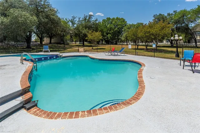 swimming pool with an outdoor seating