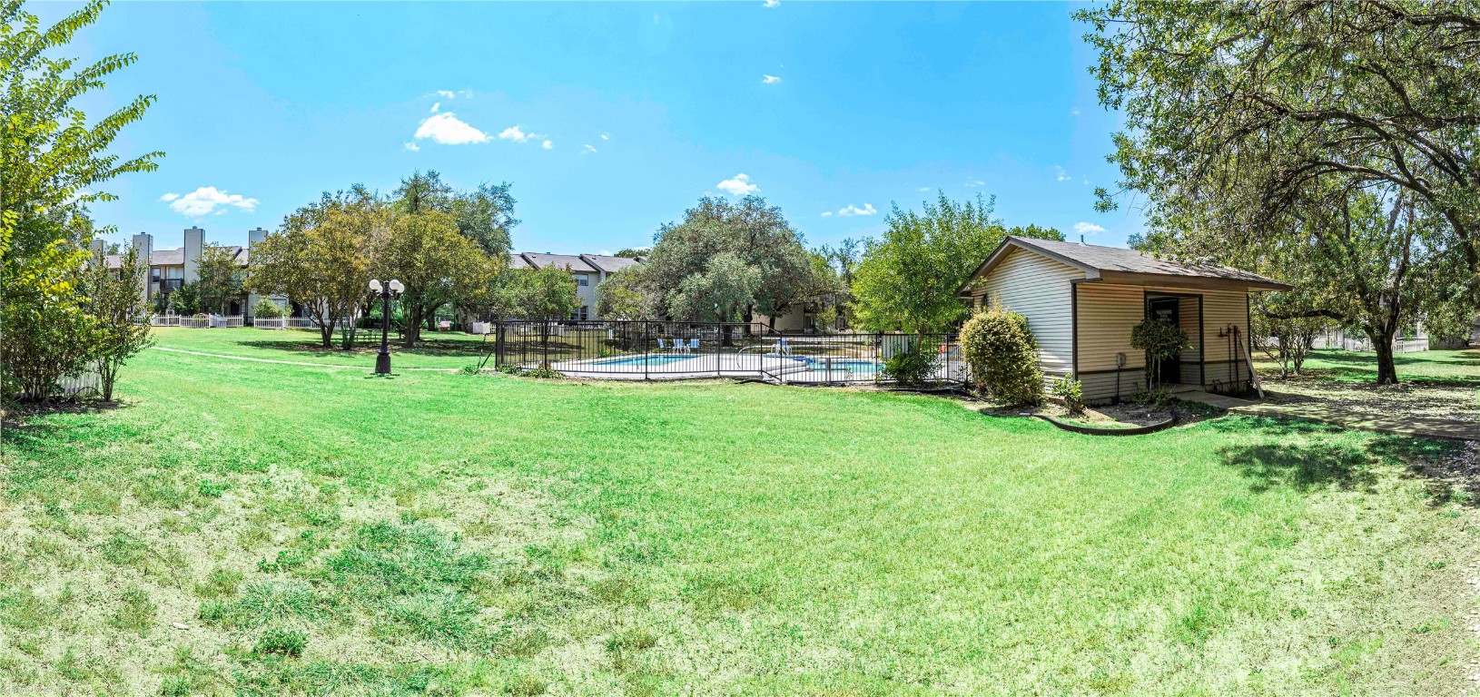 1845 River Crossing Circle, Unit C Austin, TX 78741 - Photo 26 of 28 a view of a backyard with sitting area