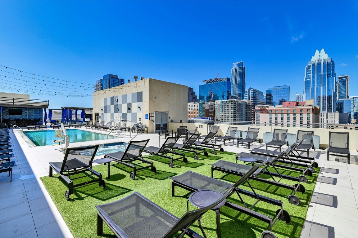 555 East 5th Street, Unit 2721 Austin, TX 78701 - Photo 14 of 33 a view of a chairs and table in a patio