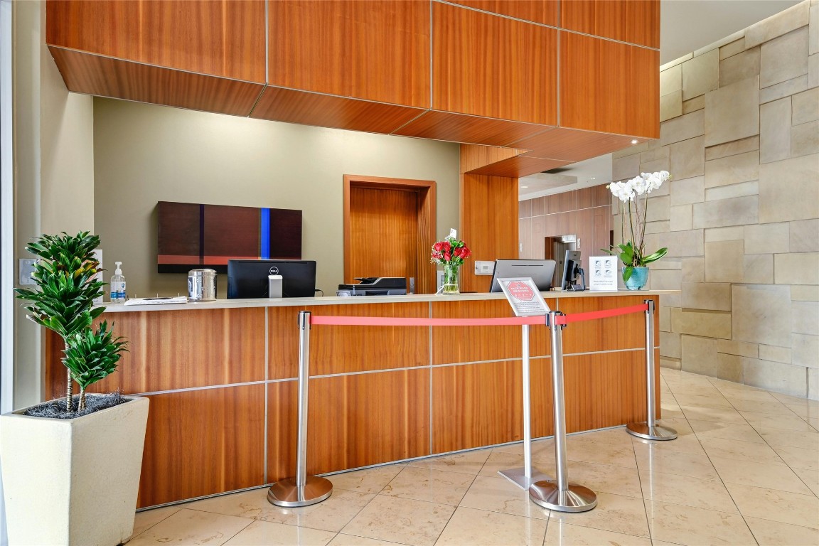 555 East 5th Street, Unit 2721 Austin, TX 78701 - Photo 19 of 33 a room with furniture a potted plant and a stove