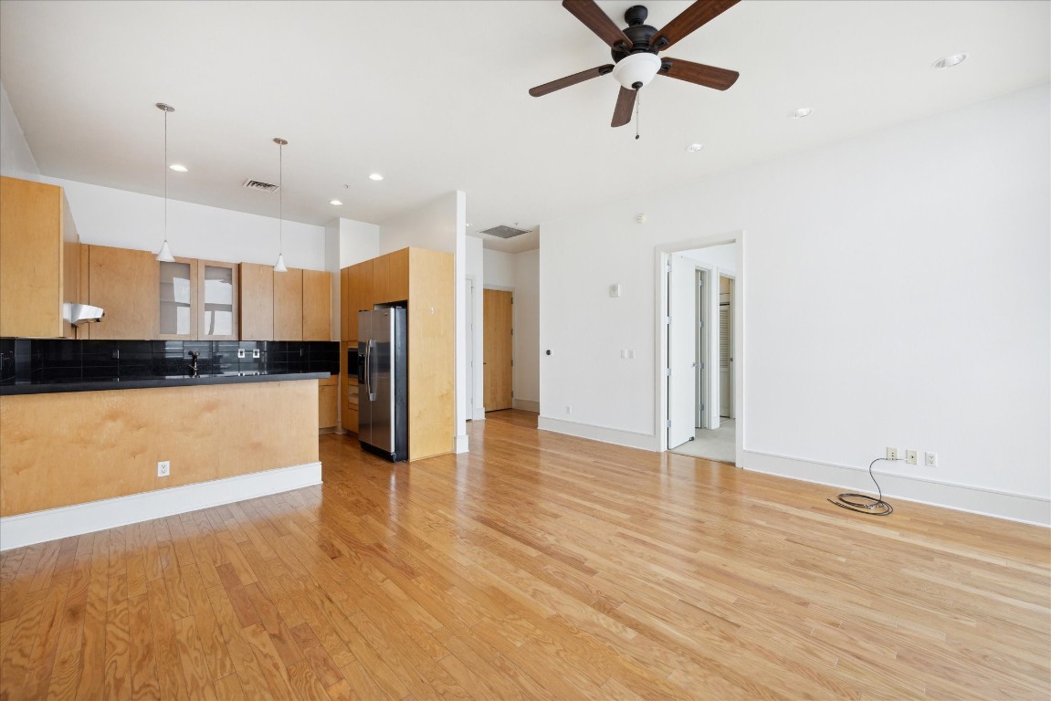 555 East 5th Street, Unit 2721 Austin, TX 78701 - Photo 20 of 33 a view of kitchen with stainless steel appliances refrigerator stove and wooden floor