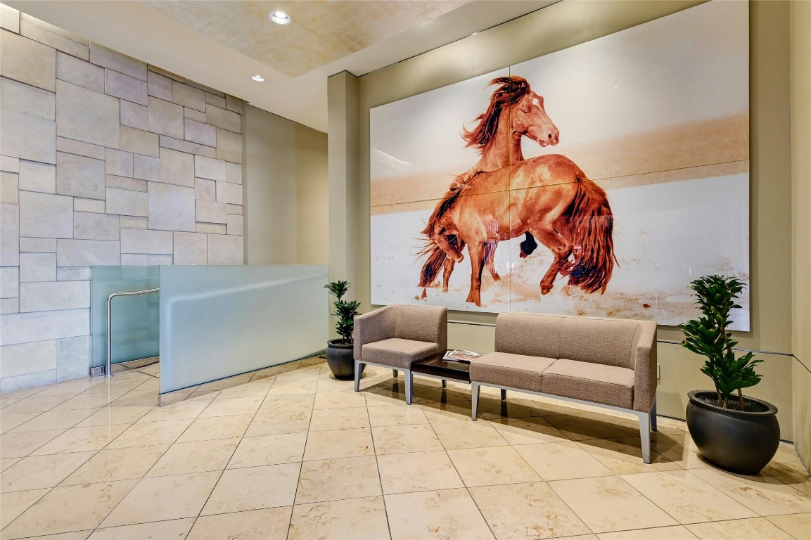 555 East 5th Street, Unit 2721 Austin, TX 78701 - Photo 24 of 33 a living room with furniture and flowers