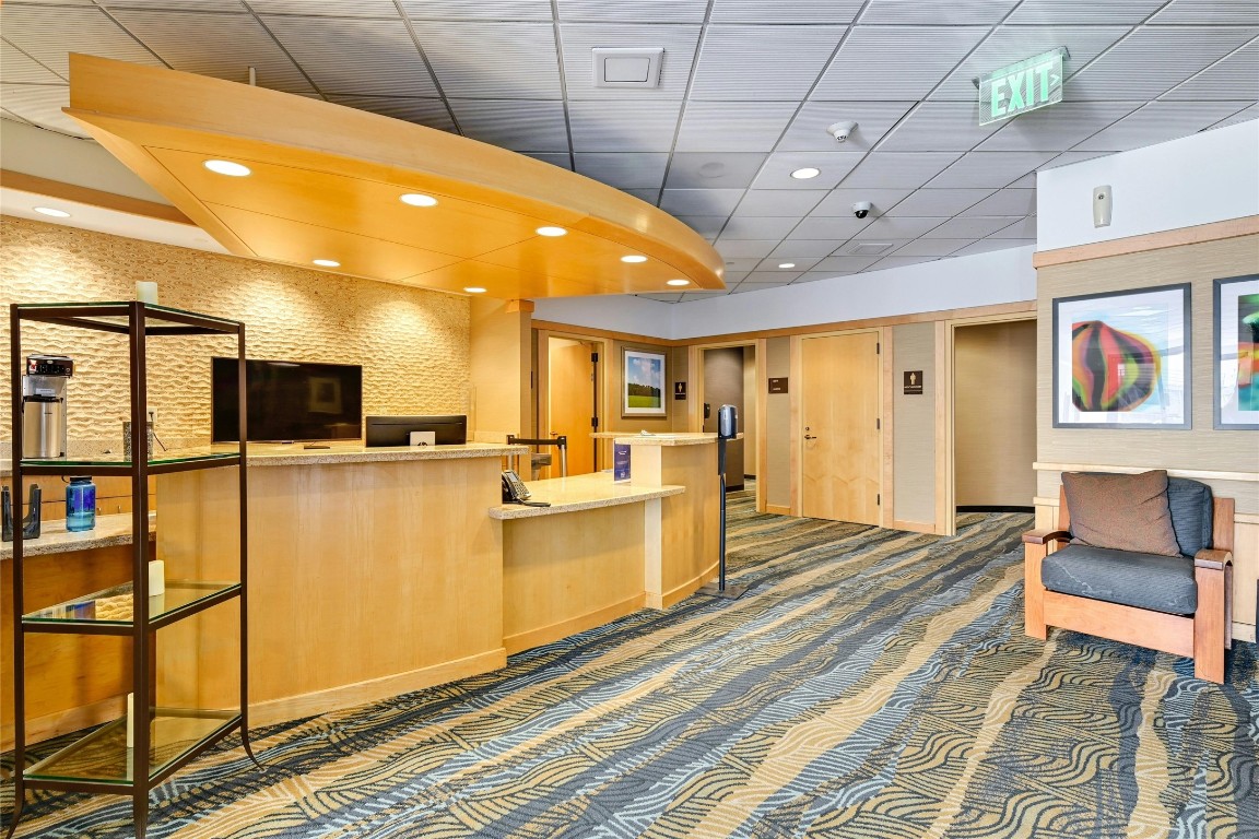 555 East 5th Street, Unit 2721 Austin, TX 78701 - Photo 27 of 33 a living room with stainless steel appliances kitchen island granite countertop furniture and a rug