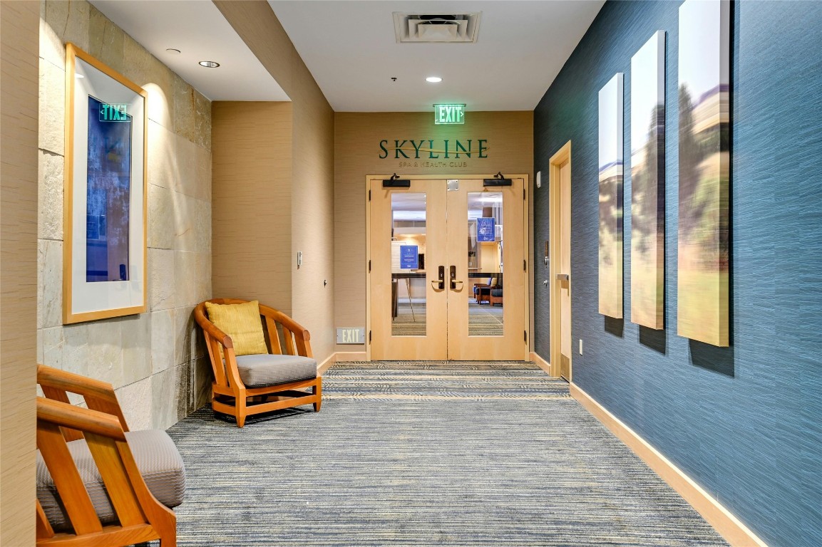 555 East 5th Street, Unit 2721 Austin, TX 78701 - Photo 28 of 33 a living room with furniture and a fireplace