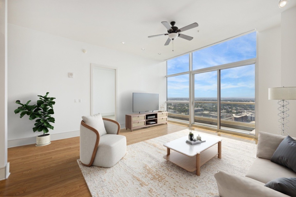 555 East 5th Street, Unit 2721 Austin, TX 78701 - Photo 3 of 33 a living room with furniture and a large window