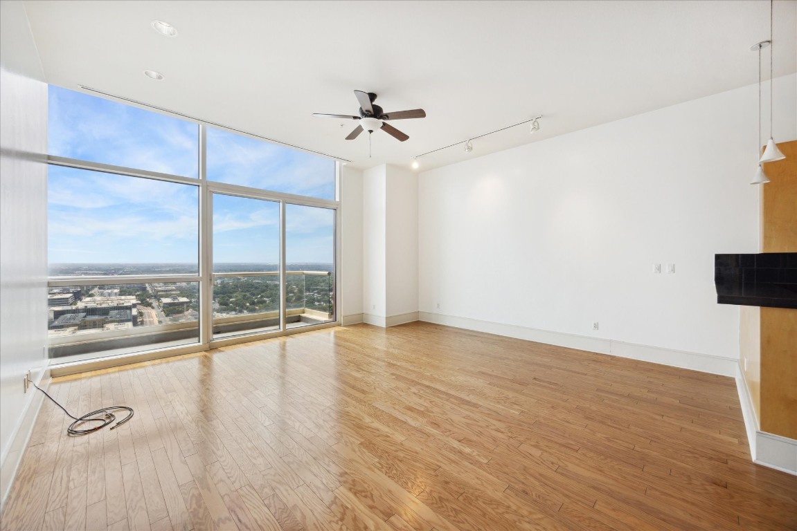 555 East 5th Street, Unit 2721 Austin, TX 78701 - Photo 33 of 33 an empty room with wooden floor and windows