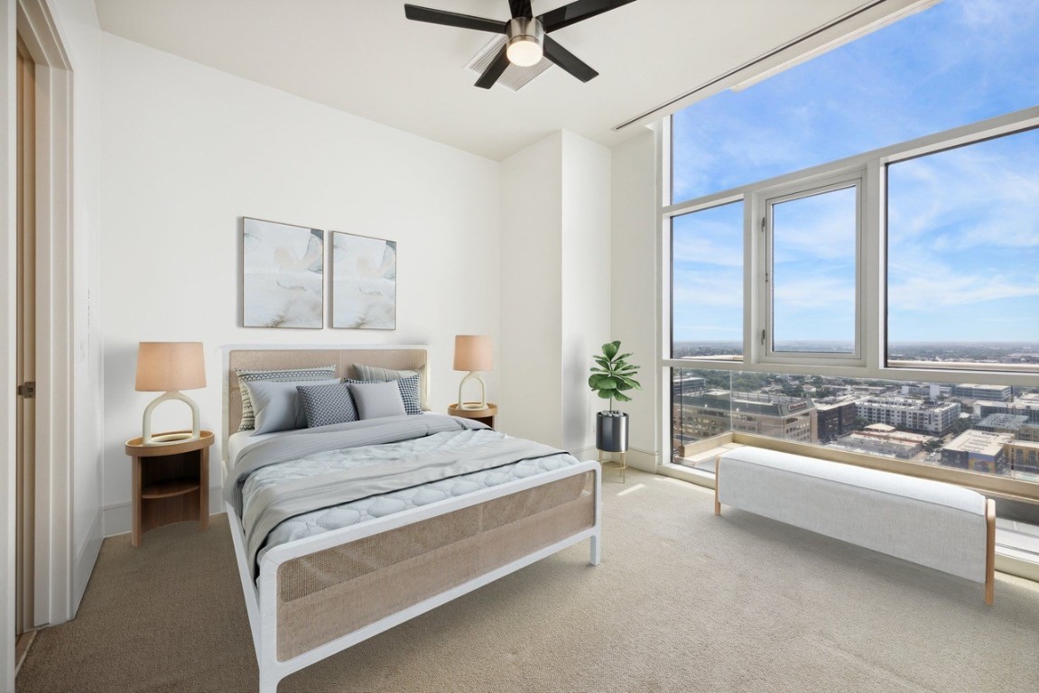 555 East 5th Street, Unit 2721 Austin, TX 78701 - Photo 7 of 33 a spacious bedroom with a bed and a large window