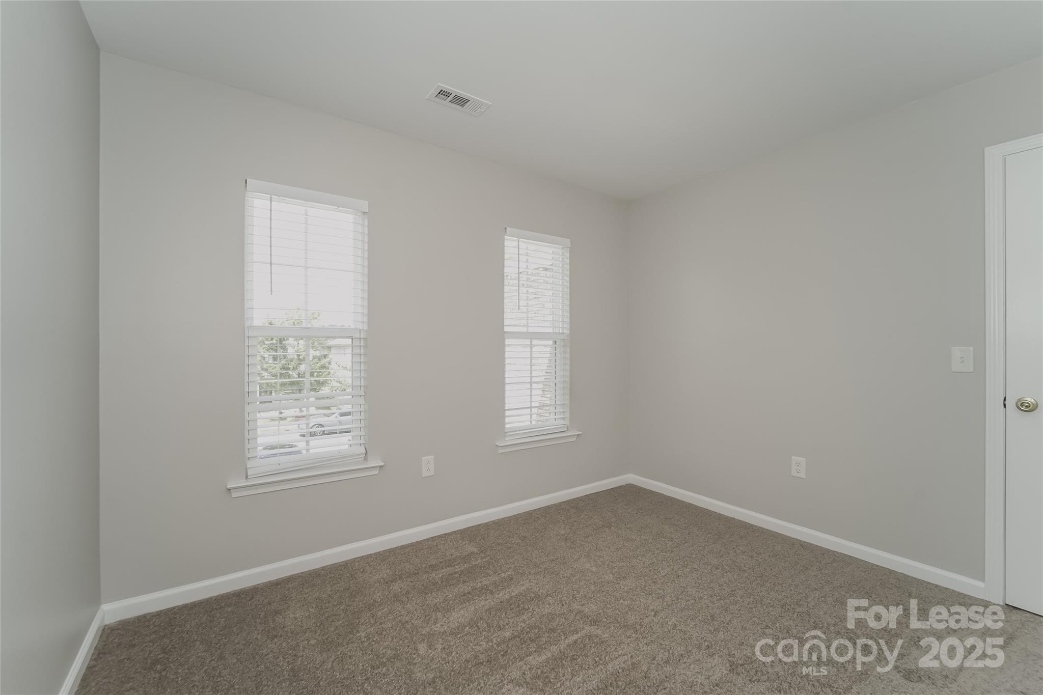 4416 Marys Point Road Monroe, NC 28110 - Photo 5 of 12 an empty room with windows