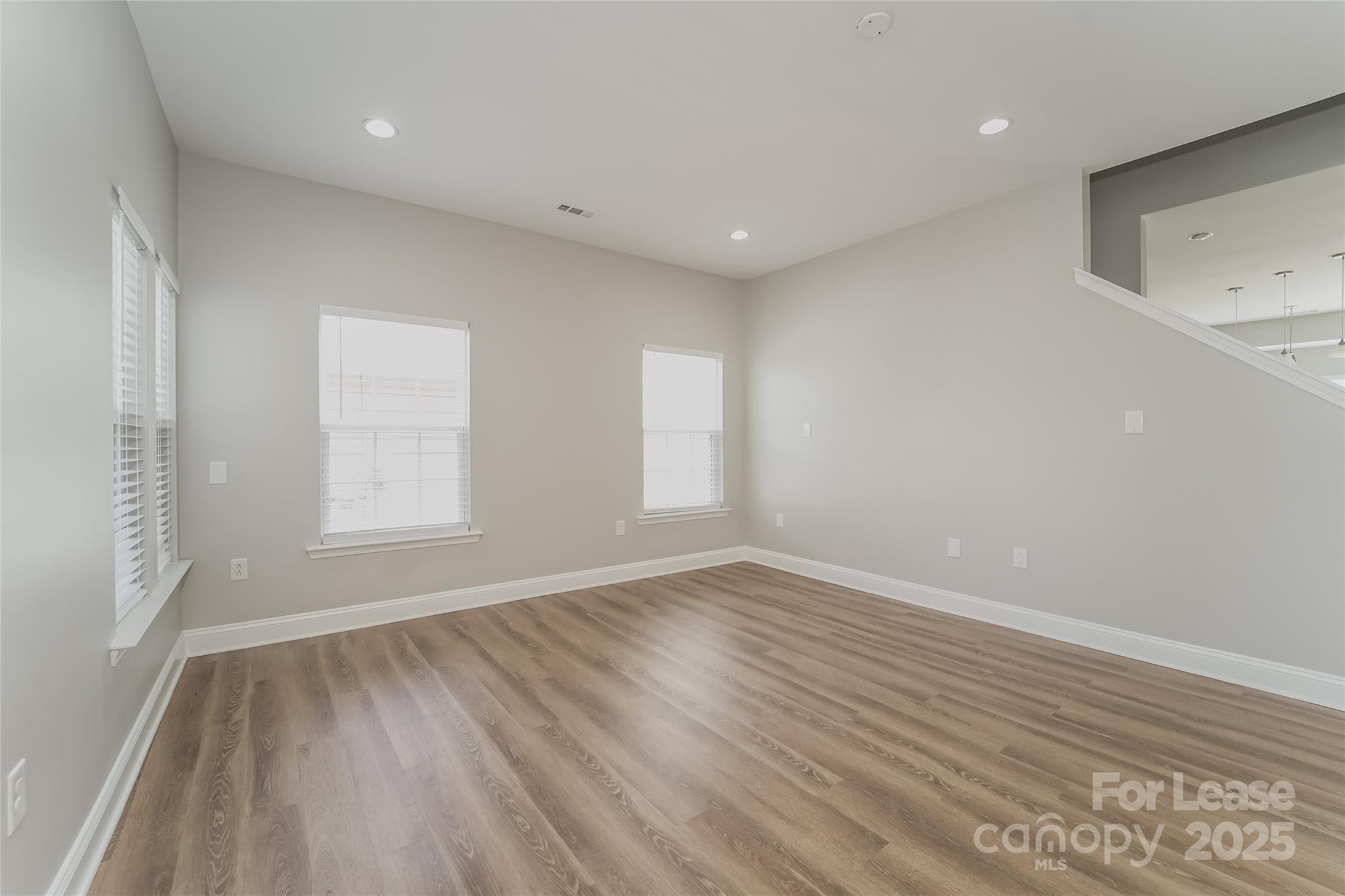 4416 Marys Point Road Monroe, NC 28110 - Photo 9 of 12 wooden floor in an empty room with a window