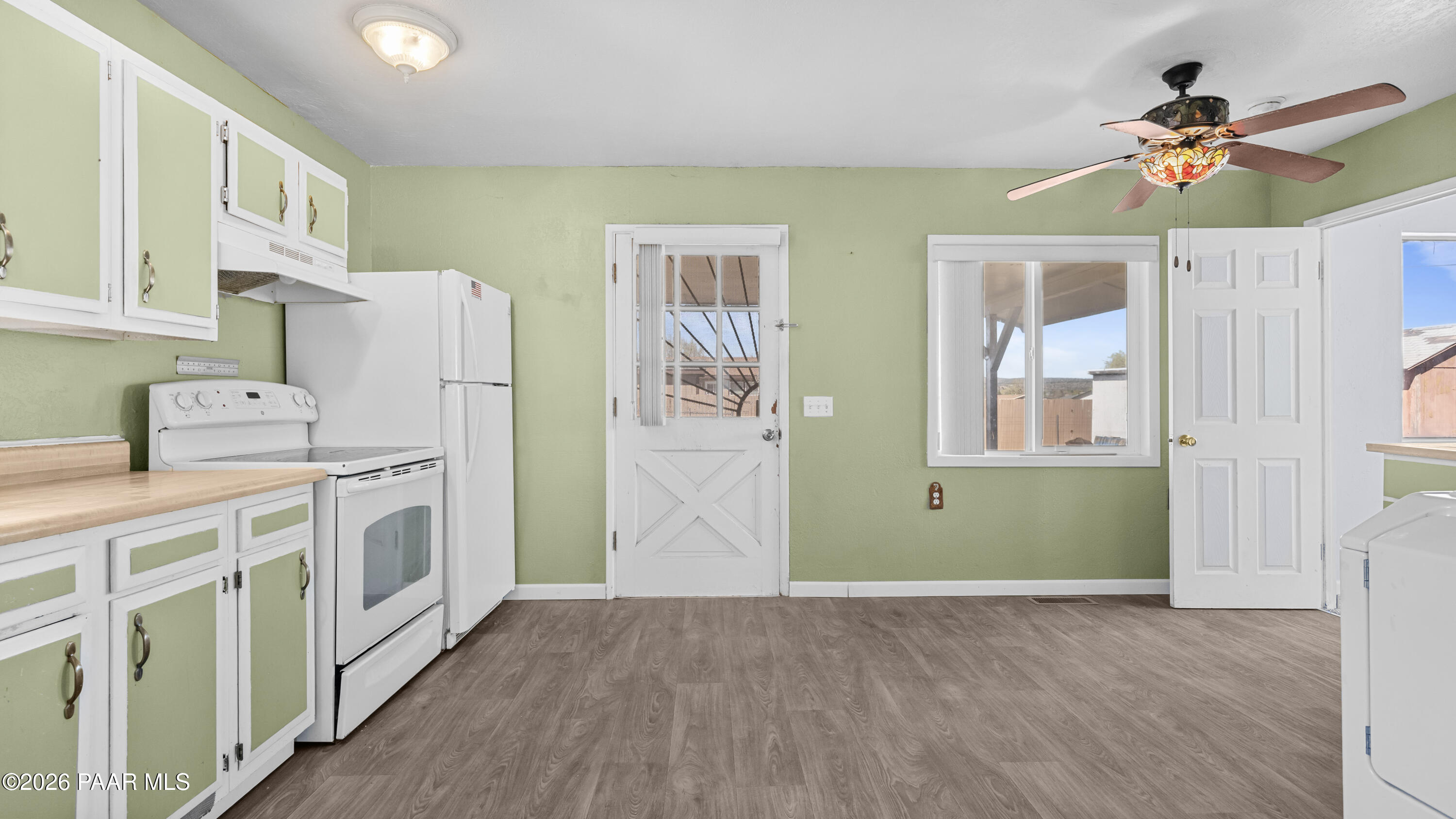 236 West Venice Way Paulden, AZ 86334 - Photo 14 of 42 a kitchen with cabinets and wooden floor