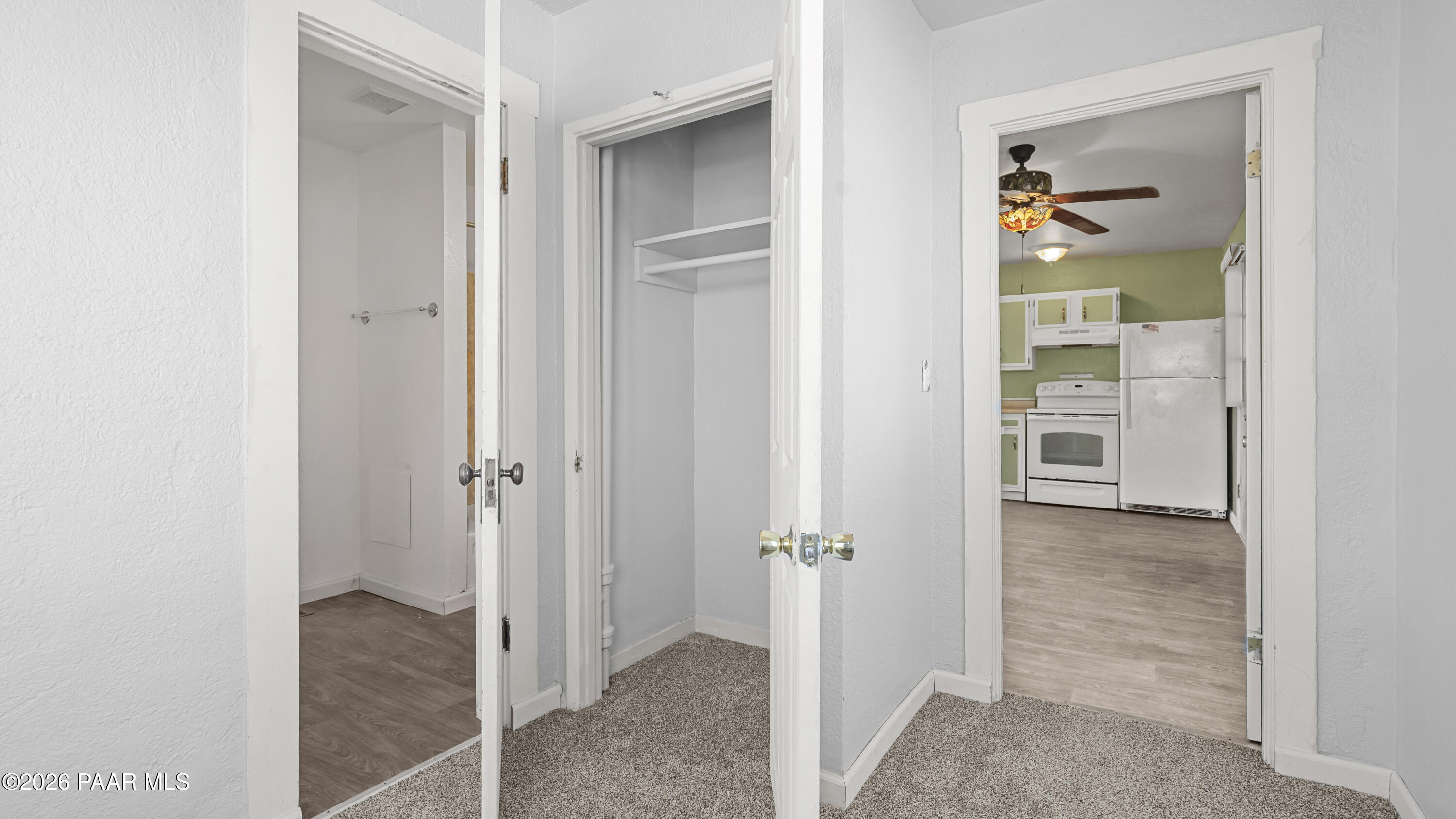 236 West Venice Way Paulden, AZ 86334 - Photo 28 of 42 a view of a hallway with wooden floor and a bathroom