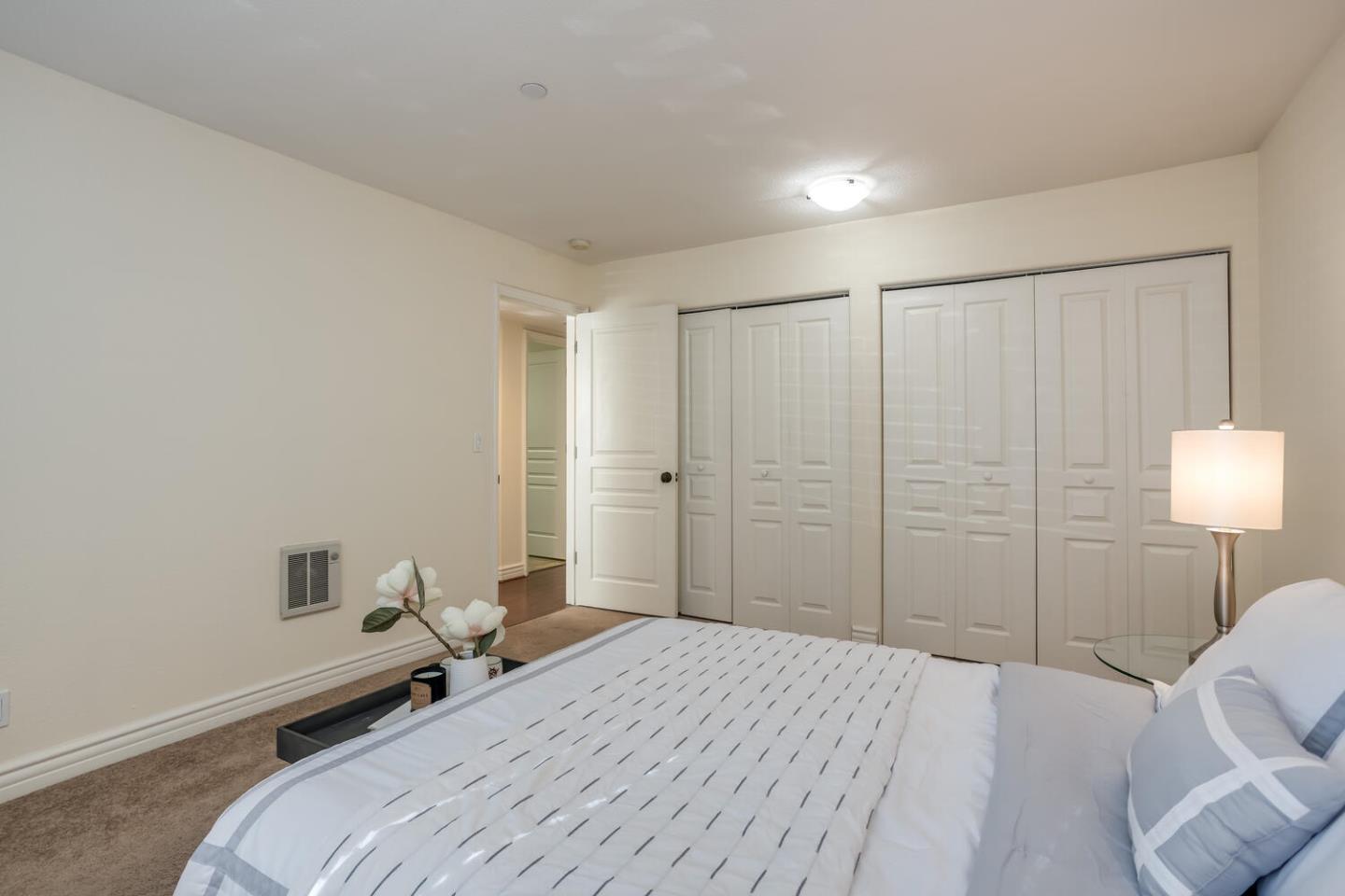 2580 Homestead Road, Unit 5101 Santa Clara, CA 95051 - Photo 19 of 33 a bedroom with a bed and a lamp