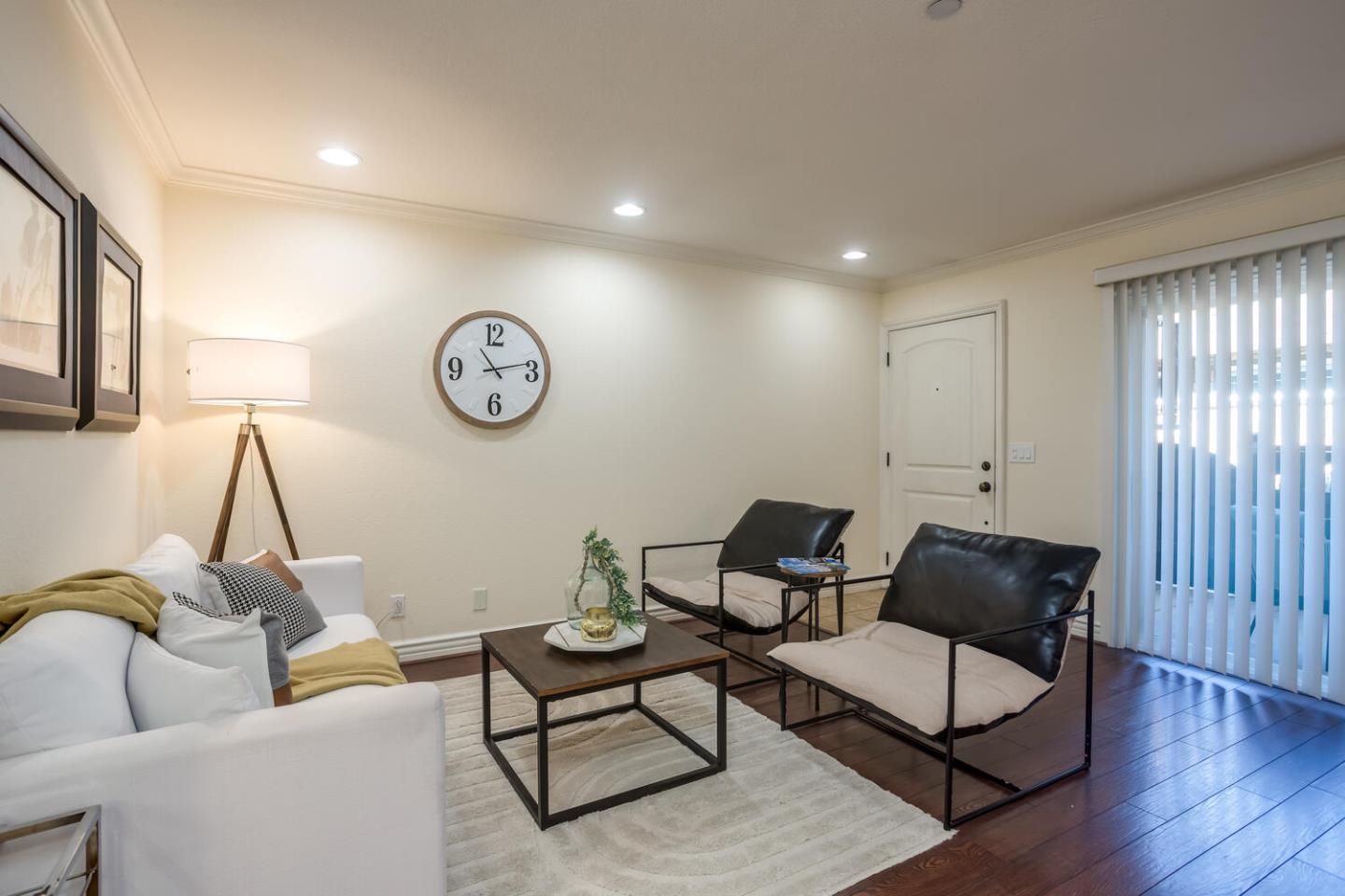 2580 Homestead Road, Unit 5101 Santa Clara, CA 95051 - Photo 3 of 33 a living room with furniture and a clock