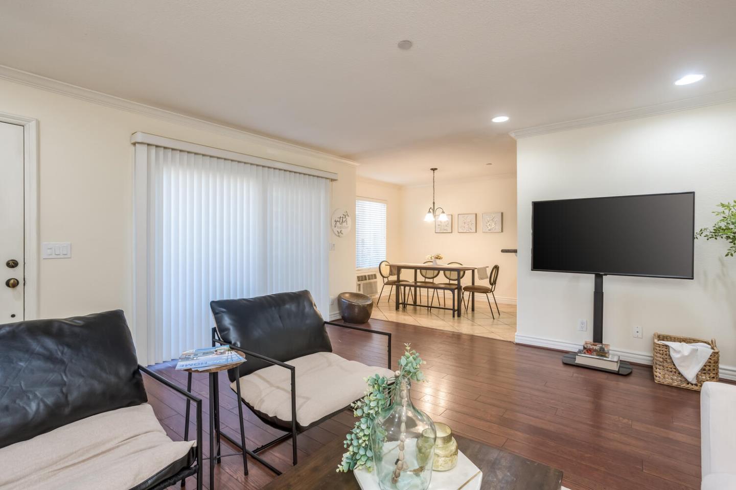 2580 Homestead Road, Unit 5101 Santa Clara, CA 95051 - Photo 4 of 33 a living room with furniture and a flat screen tv