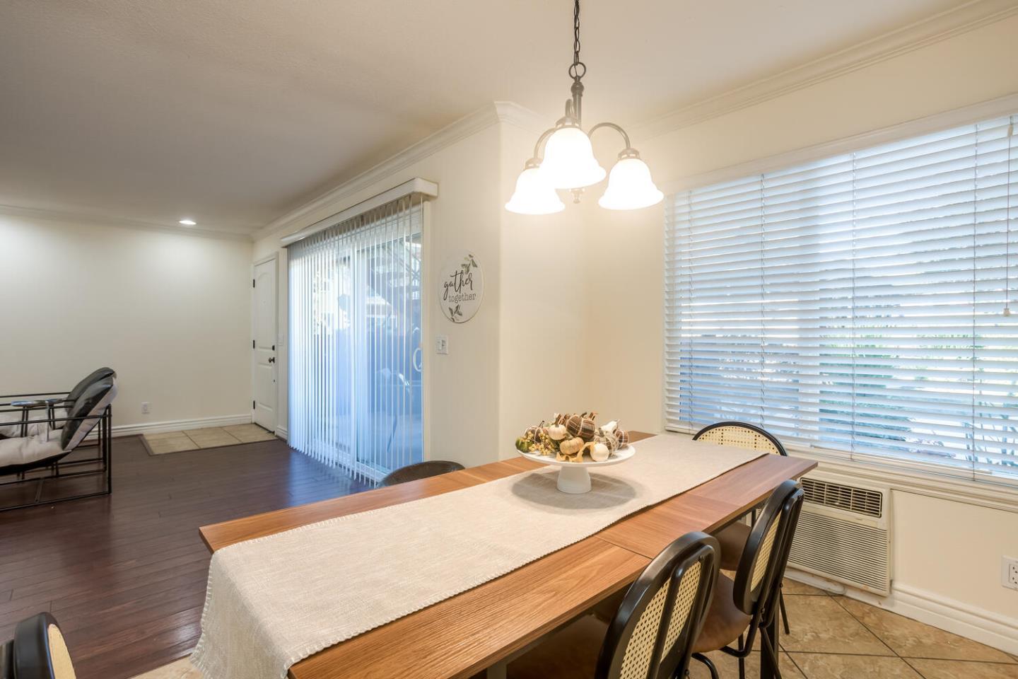 2580 Homestead Road, Unit 5101 Santa Clara, CA 95051 - Photo 5 of 33 a view of a dining room with furniture window and wooden floor