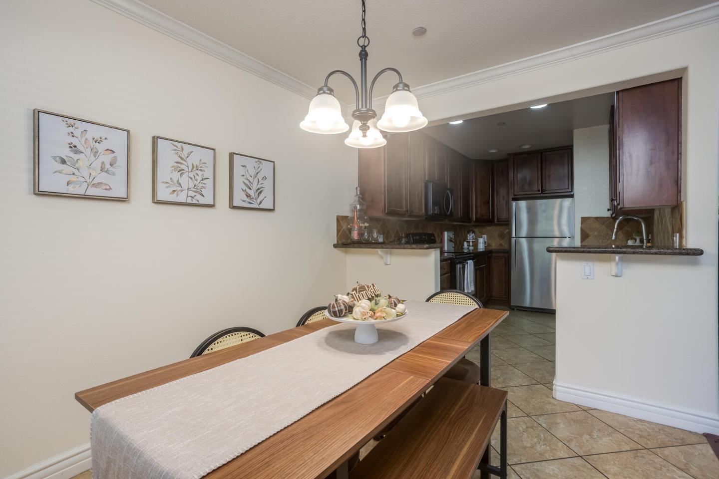 2580 Homestead Road, Unit 5101 Santa Clara, CA 95051 - Photo 7 of 33 a view of kitchen with cabinets stainless steel appliances and a center island