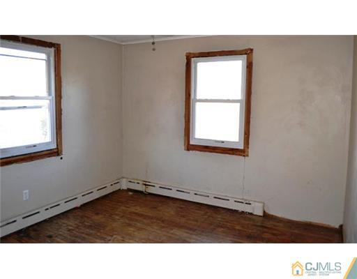 4 Brant Street South River, NJ 08882 - Photo 4 of 4 an empty room with a window