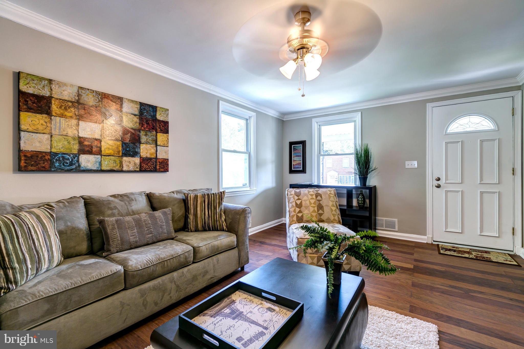 7412 Kirtley Road Baltimore, MD 21222 - Photo 5 of 30 Living Room With Crown Moldings