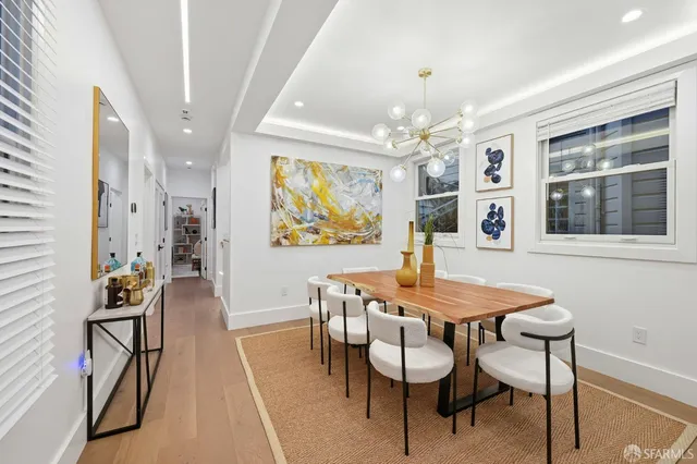 a view of a patio with table and chairs and potted plants