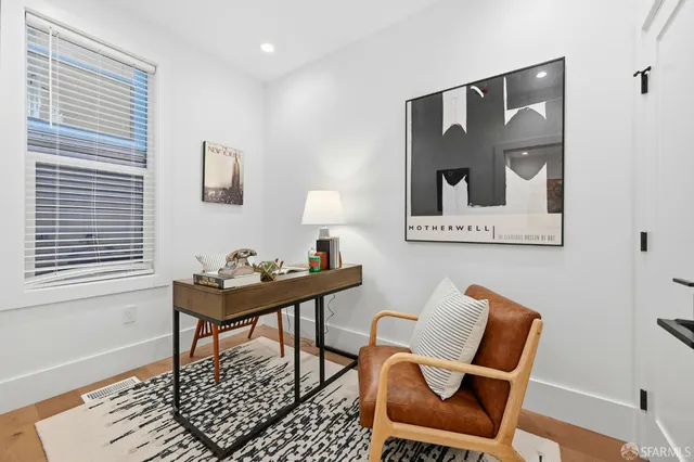 a view of a patio with table and chairs and potted plants