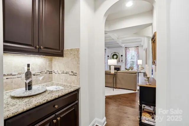 a view of a dining room with furniture wooden floor and chandelier