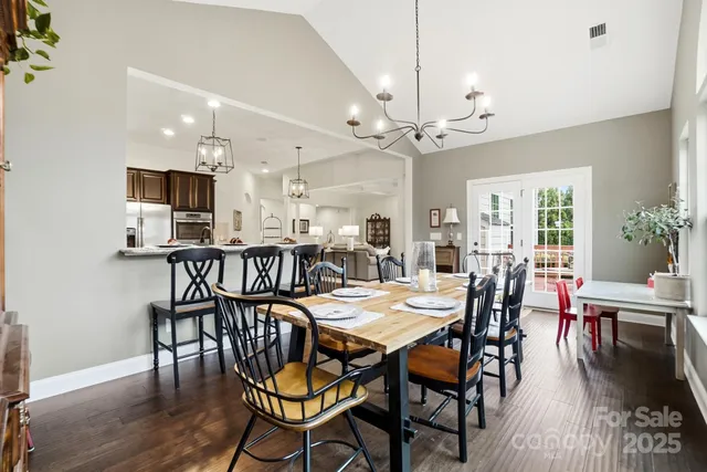a bedroom with a bed dresser and a large window