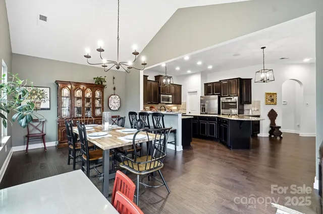 a spacious bathroom with a granite countertop sink and a mirror